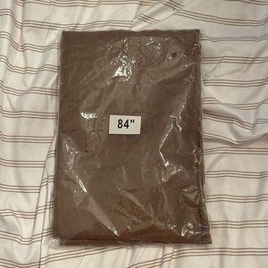 NEW Brown single panel sheer curtain. 84 inches long.